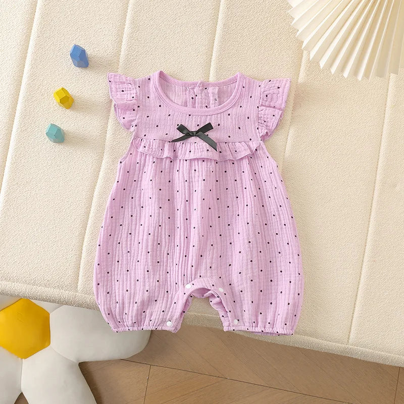 Combinaison bébé fille à pois et nœud papillon