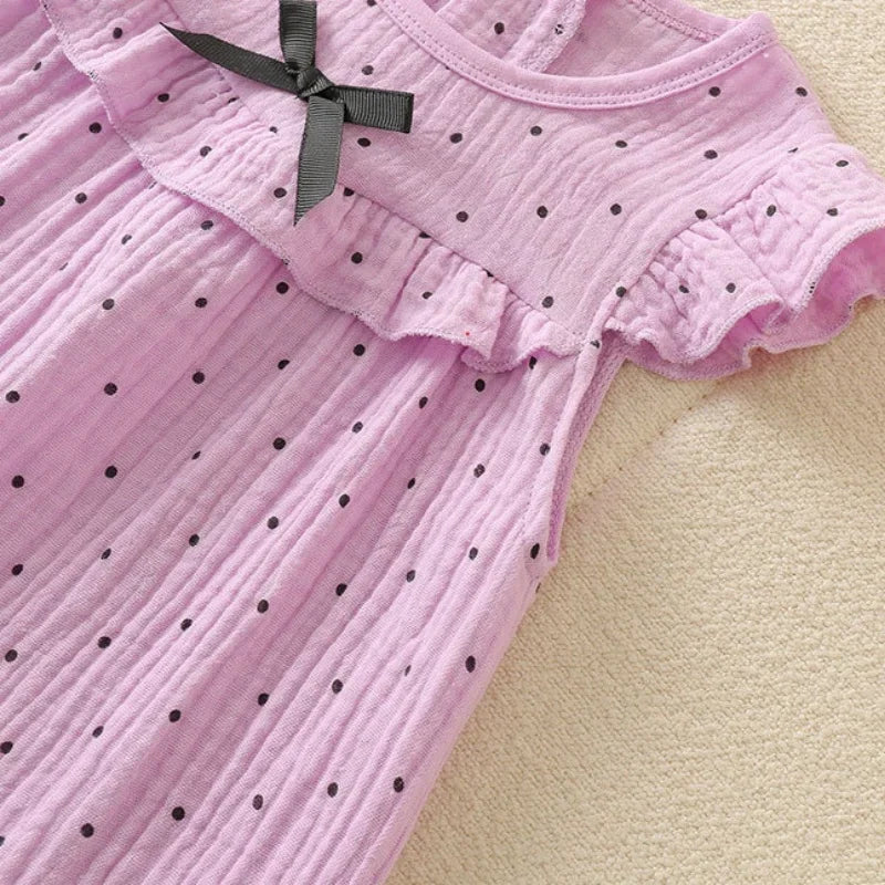 Combinaison bébé fille à pois et nœud papillon