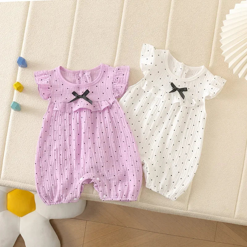 Combinaison bébé fille à pois et nœud papillon