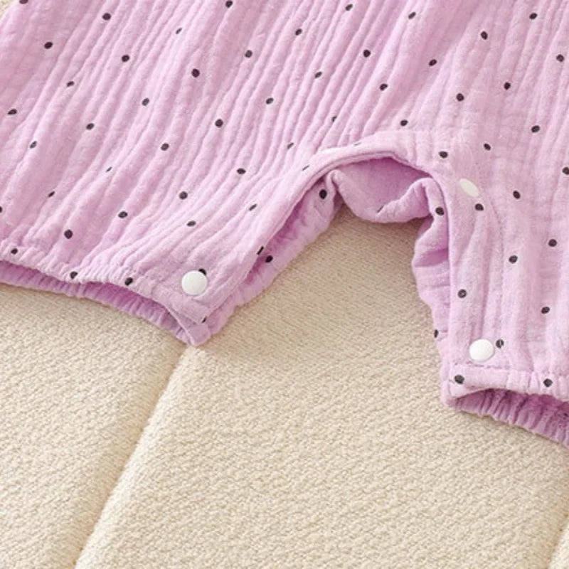 Combinaison bébé fille à pois et nœud papillon