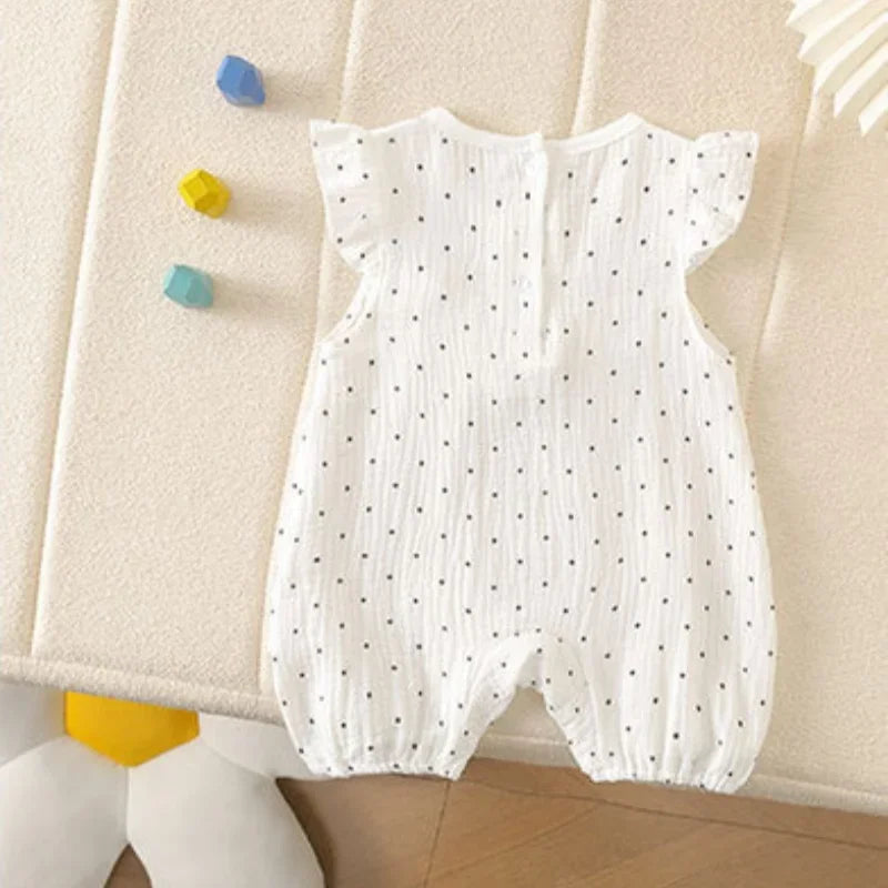 Combinaison bébé fille à pois et nœud papillon