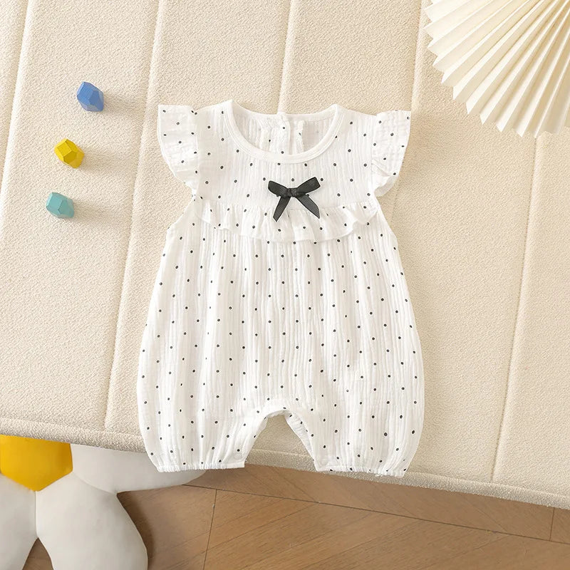 Combinaison bébé fille à pois et nœud papillon