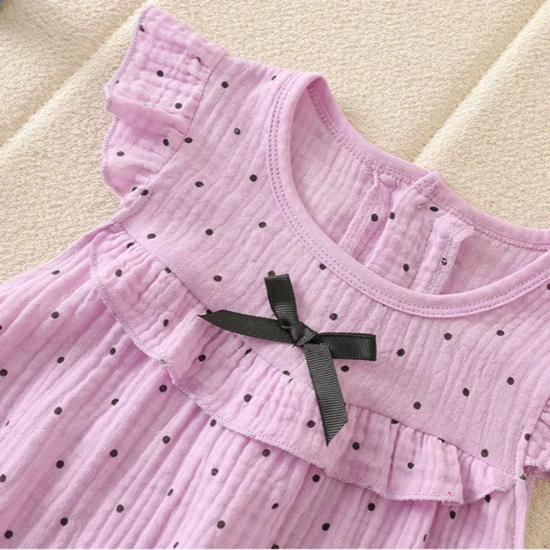 Combinaison bébé fille à pois et nœud papillon